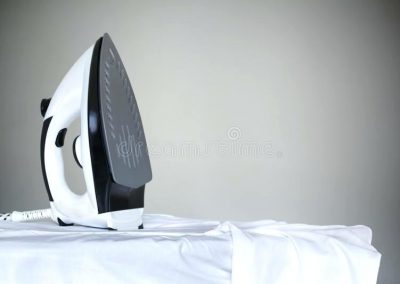 steaming-vs-ironing-ironing-a-white-shirt-with-a-steam-iron-on-an-ironing-board